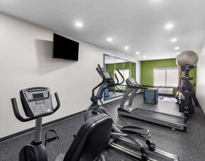 Well equipped fitness center at Spark By Hilton Pearland.