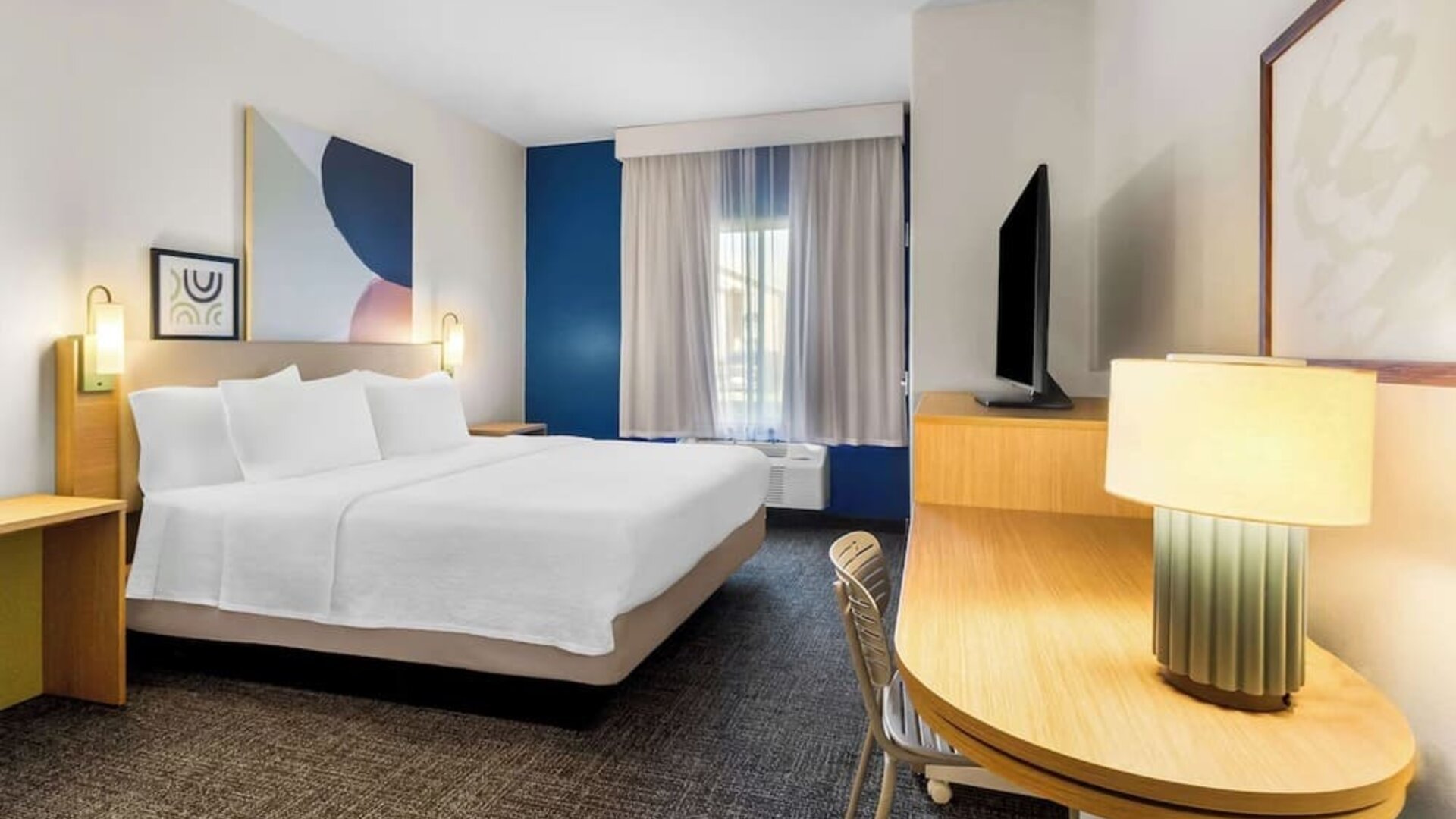 Day use room with natural light and work desk at Spark By Hilton Pearland.