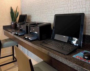 Business center with computers and printer at Sonesta ES Suites San Antonio Downtown Alamo Plaza.