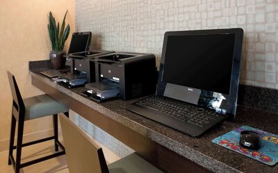 Business center with computers and printer at Sonesta ES Suites San Antonio Downtown Alamo Plaza.