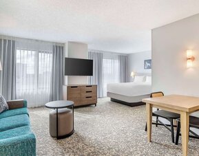 Day use room with workspace and lounge area at Sonesta ES Suites San Antonio Downtown Alamo Plaza.