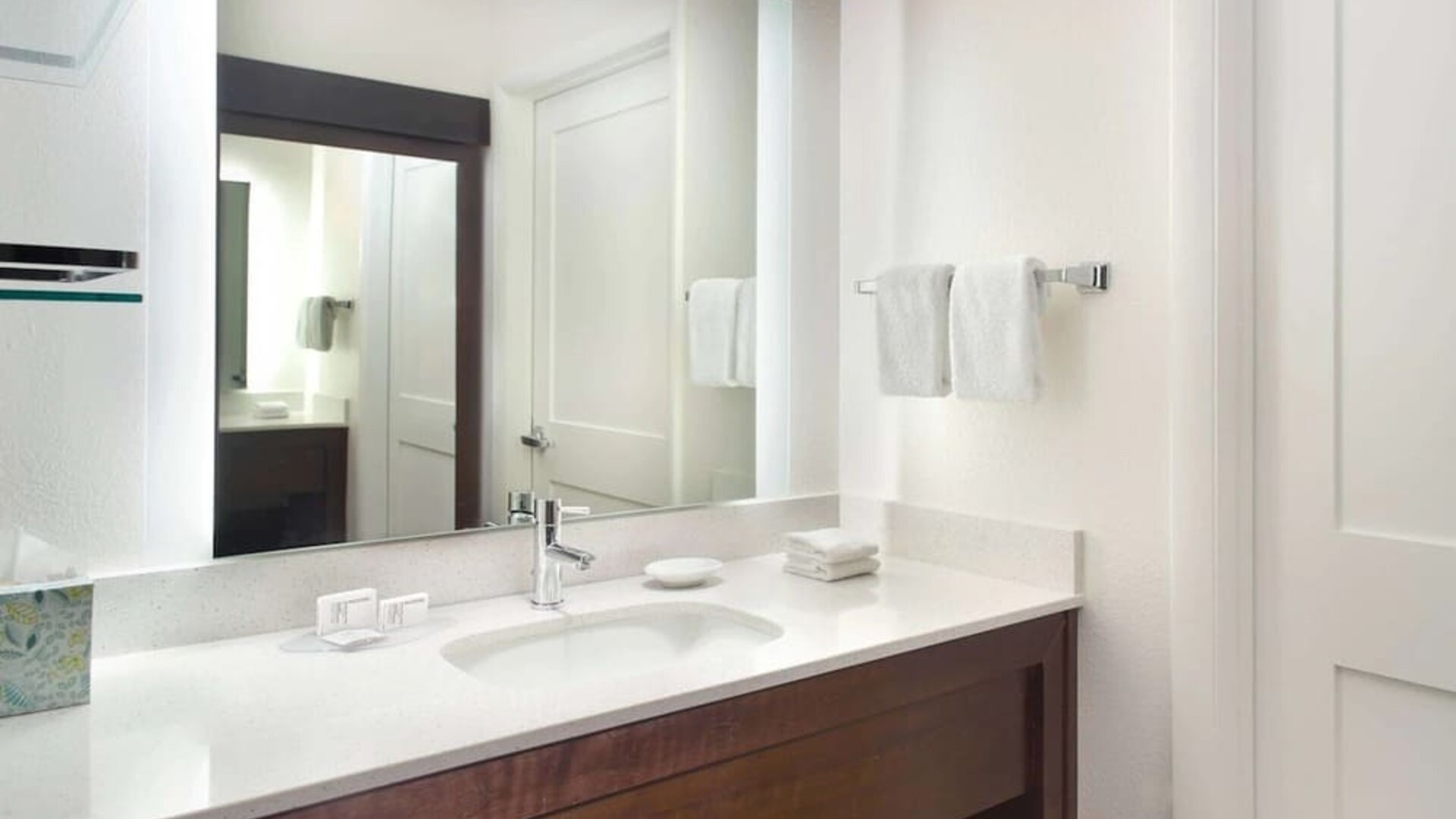 Private guest bathroom with shower and free toiletries at Sonesta ES Suites Raleigh Cary 