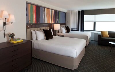 Day use twin room with lounge area at The Fifty Sonesta Select New York.