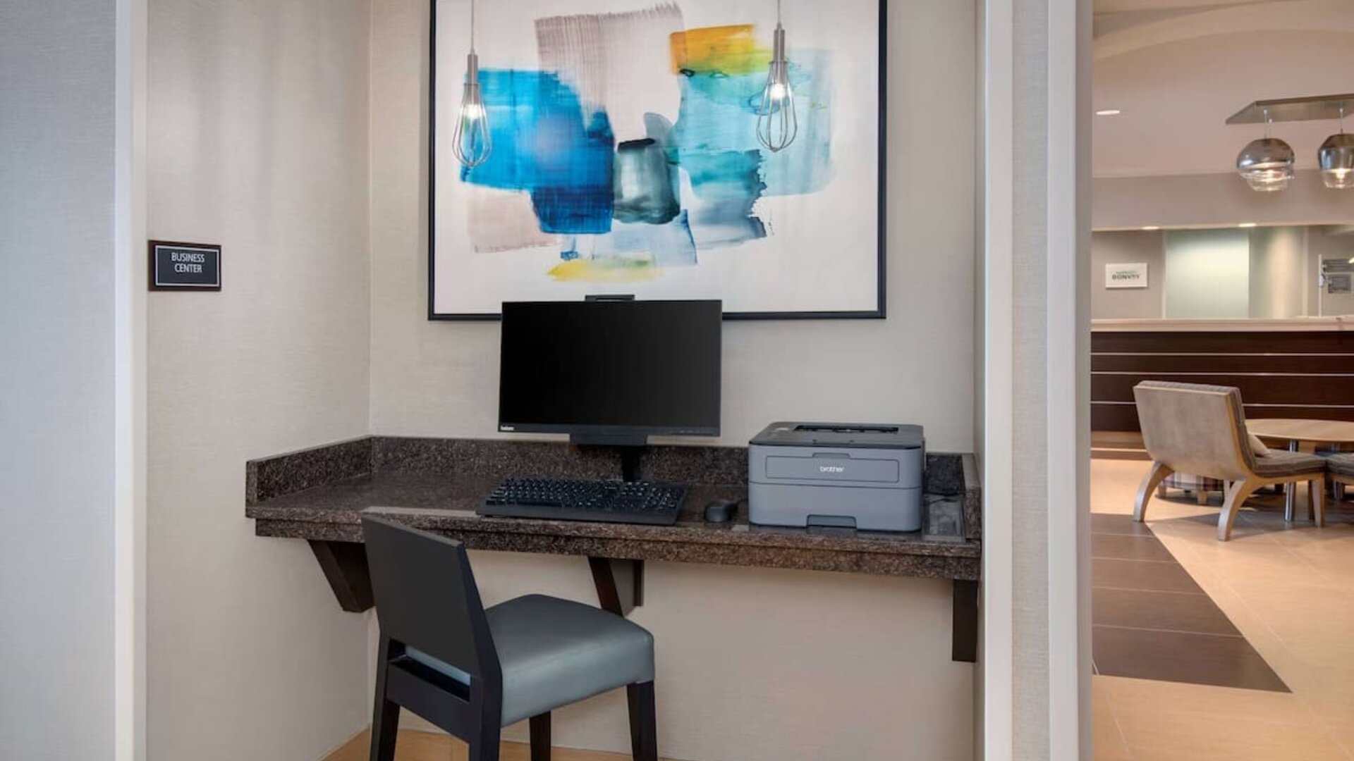 Business center with computer and printer at Sonesta ES Suites Atlanta Alpharetta North Point Mall.