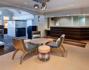 Reception and lounge area at Sonesta ES Suites Atlanta Alpharetta North Point Mall.