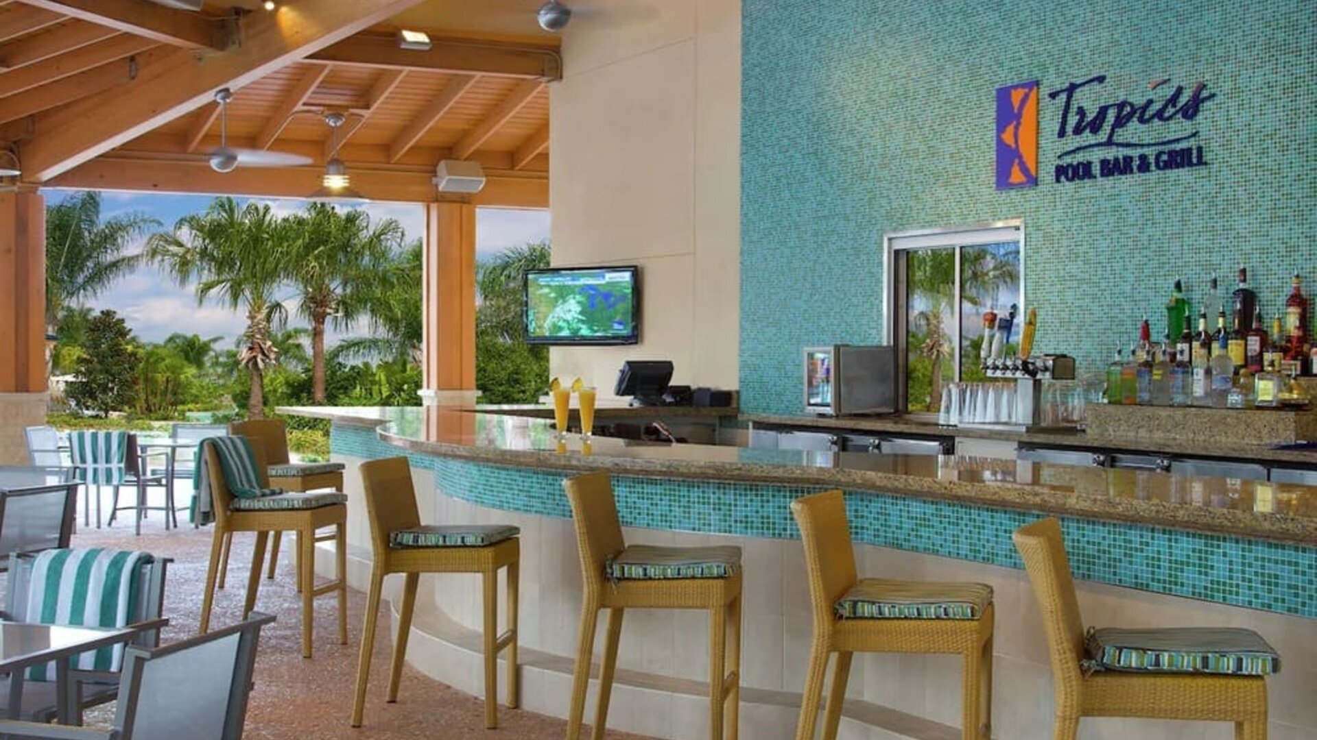 Beautiful and relaxing outdoor bar and restaurant by the pool at Hilton Orlando.