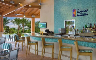 Beautiful and relaxing outdoor bar and restaurant by the pool at Hilton Orlando.