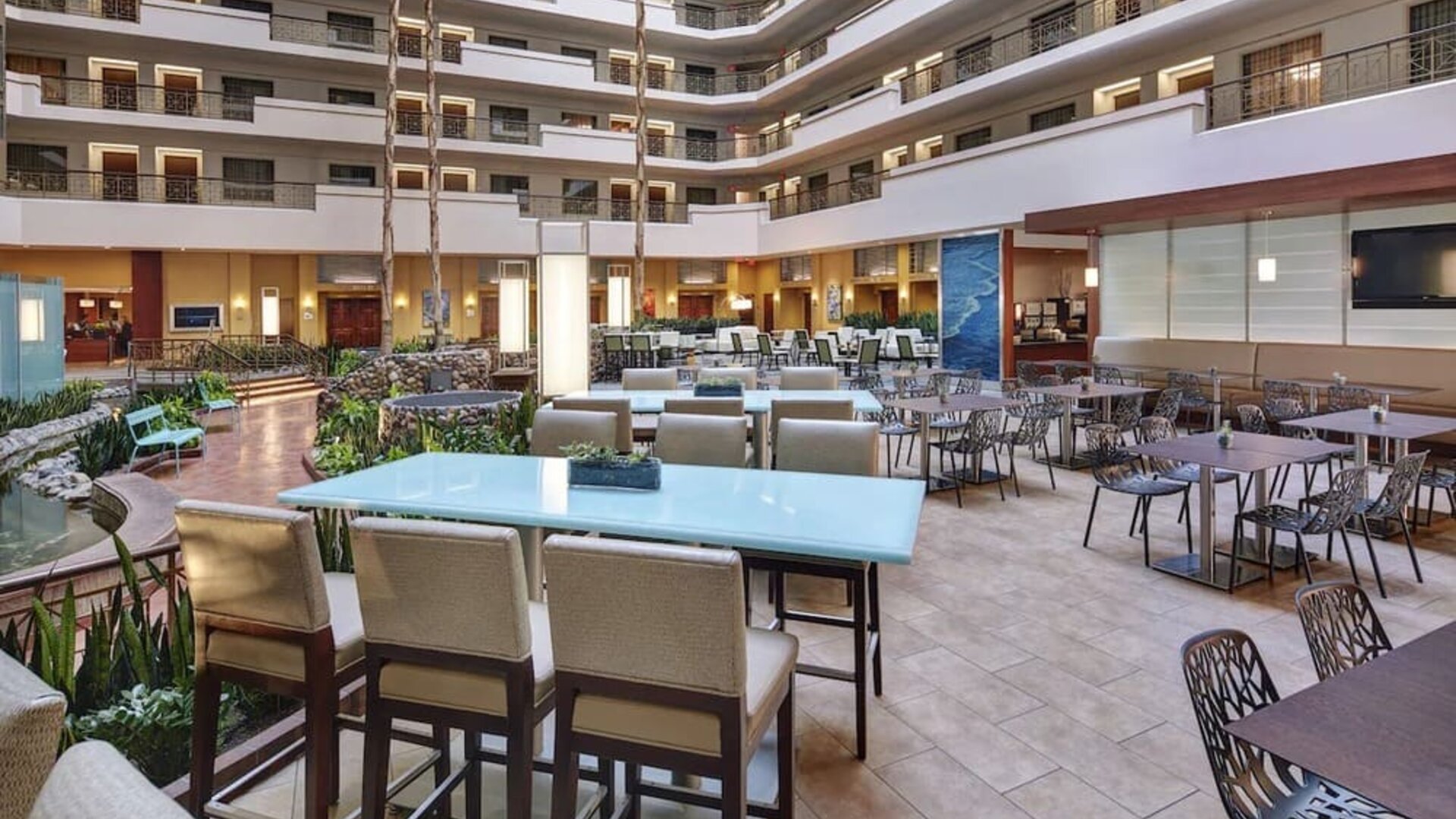 Breakfast area with natural light perfect for coworking at Embassy Suites By Hilton San Diego-La Jolla.