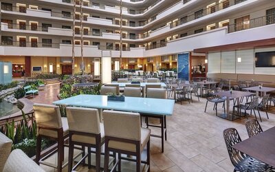 Breakfast area with natural light perfect for coworking at Embassy Suites By Hilton San Diego-La Jolla.