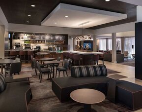 Dining area with comfortable seating, perfect for coworking at Sonesta Select Phoenix Camelback.