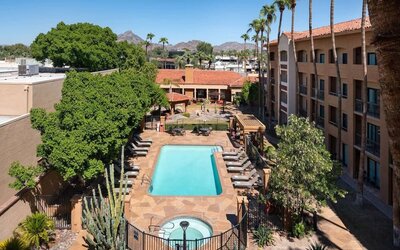 Outdoor pool with lounge seating at Sonesta Select Phoenix Camelback.