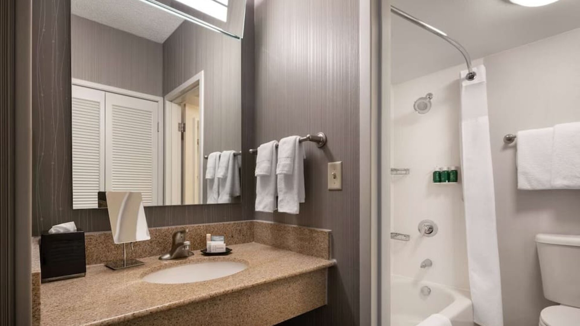 Private guest bathroom with free toiletries at Sonesta Select Phoenix Camelback.
