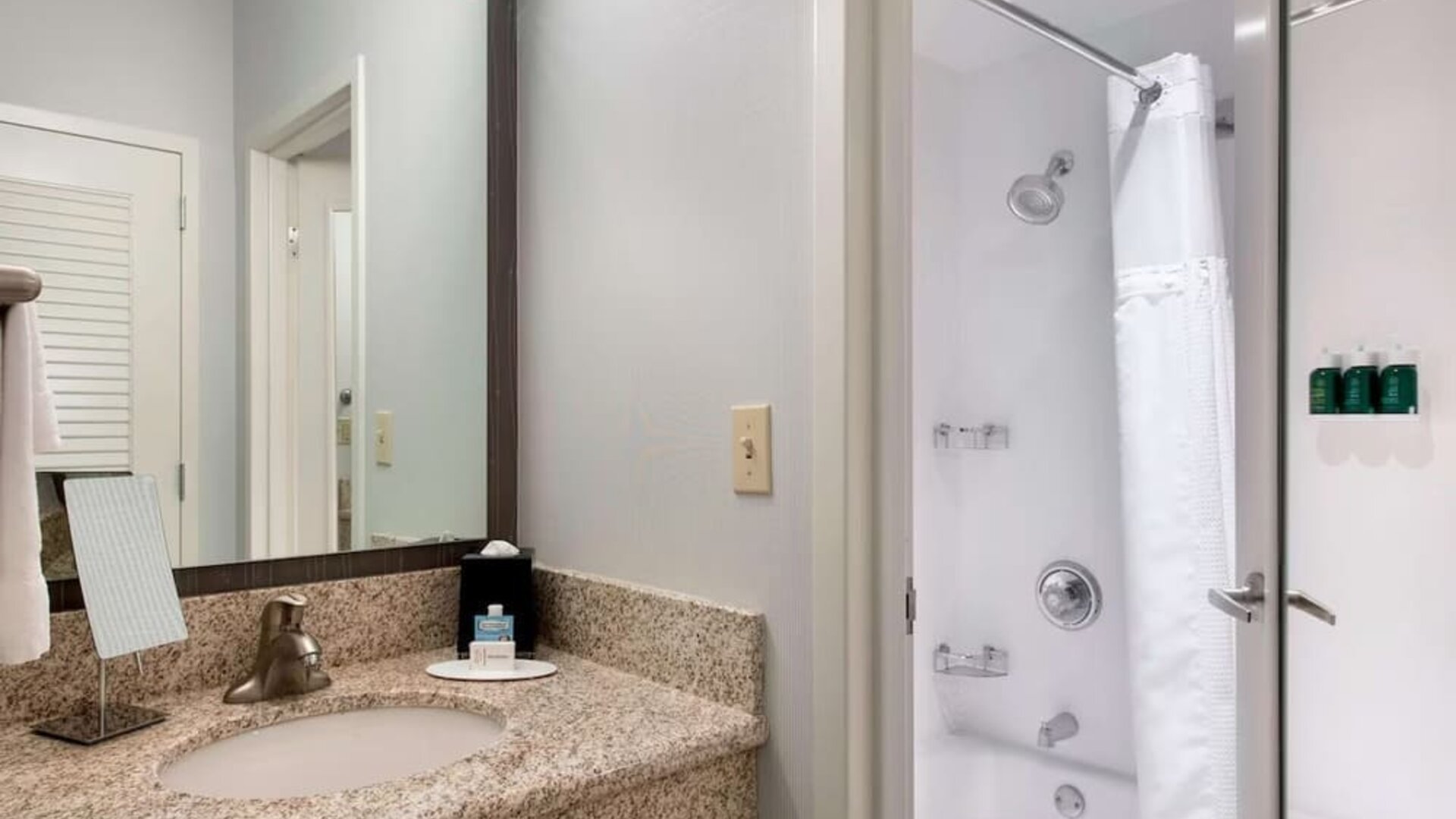 Private guest bathroom with shower and free toiletries at Sonesta Select Newport Middletown.