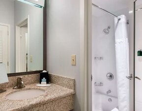 Private guest bathroom with shower and free toiletries at Sonesta Select Newport Middletown.