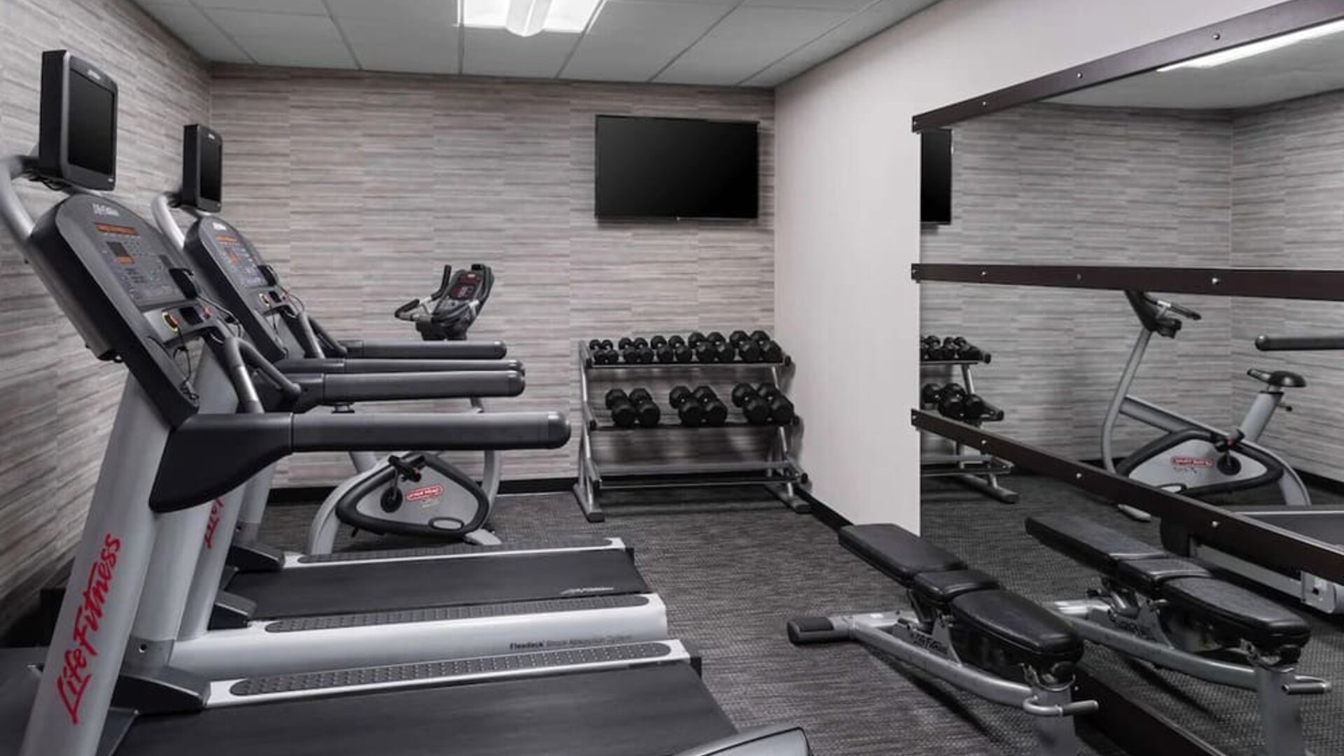 Well equipped fitness center at Sonesta Select Newport Middletown.