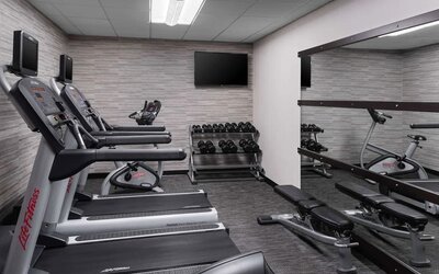 Well equipped fitness center at Sonesta Select Newport Middletown.