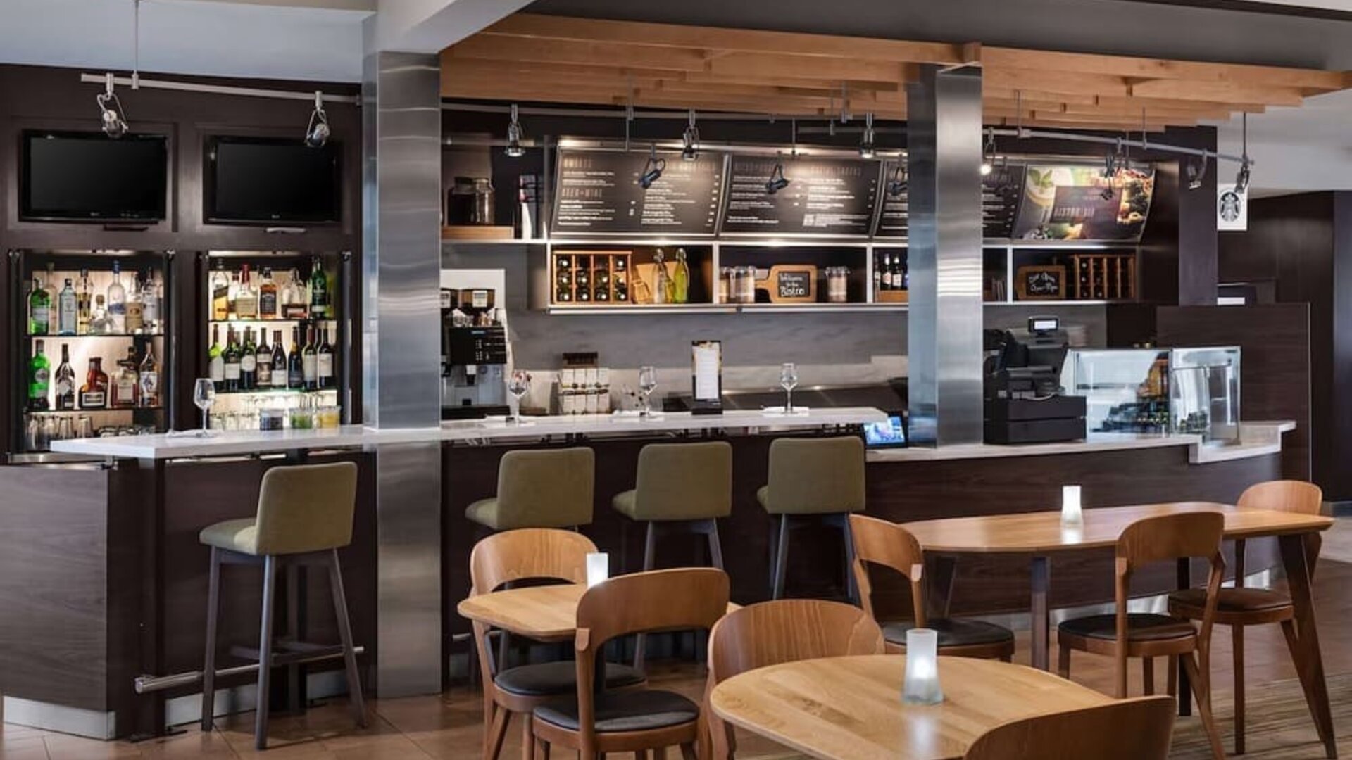 On-site coffee shop with seating area, perfect for coworking at Sonesta Select Newport Middletown.