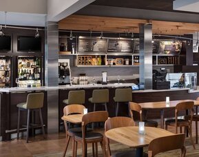 On-site coffee shop with seating area, perfect for coworking at Sonesta Select Newport Middletown.