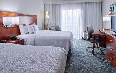 Bright and spacious day use twin room with work desk and floor to ceiling window at Sonesta Select Indianapolis Carmel.