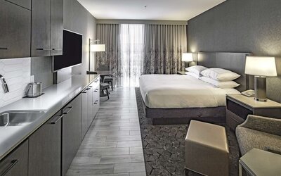 Day use room with mini kitchen and TV at DoubleTree By Hilton Modesto.