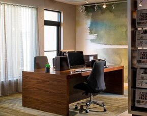 Business center with computers, printer and ergonomic chairs at Sonesta Select Boca Raton.