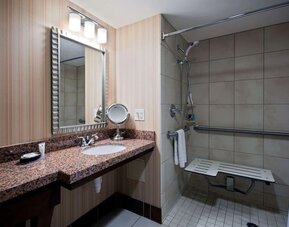 Private guest bathroom with shower at Sonesta Milwaukee West Wauwatosa.