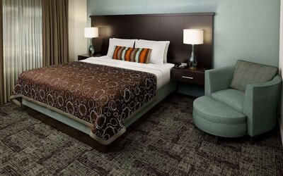 Bright and spacious day use room with sofa at Sonesta ES Suites Dallas Las Colinas.