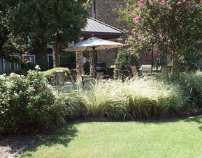 Patio with lounge seating at Sonesta ES Suites Dallas Las Colinas.