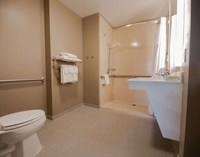 Private guest bathroom with shower at Sonesta ES Suites Dallas Las Colinas.
