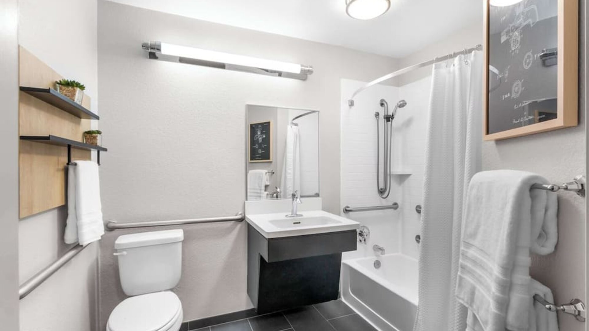 Private guest bathroom at Sonesta Simply Suites Austin South.