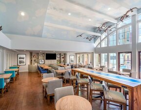 Dining area perfect for coworking at Hampton Inn & Suites Amelia Island-Historic Harbor Front.