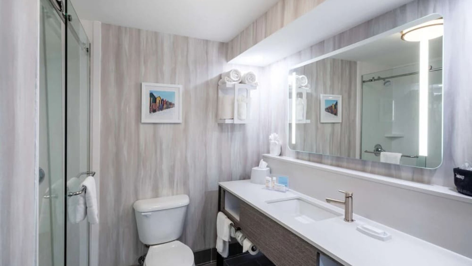 Guest bathroom with shower at Hampton Inn & Suites Amelia Island-Historic Harbor Front.