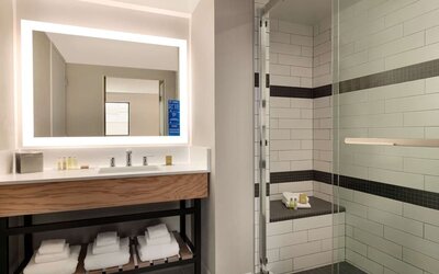 Guest bathroom with shower at DoubleTree By Hilton Canton Downtown.