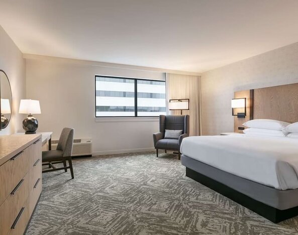 Spacious king size bed, TV and desk in a day use room at DoubleTree By Hilton Canton Downtown.