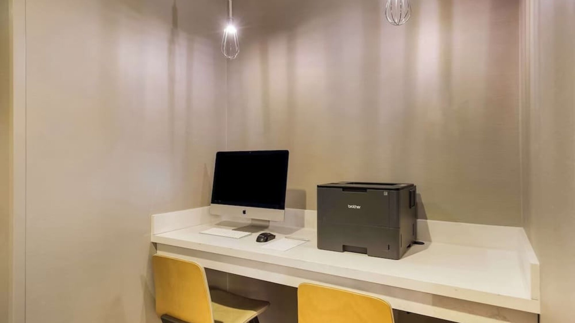 Business center with computer, printer and ergonomic chair at Sonesta ES Suites Parsippany Morris Plains.