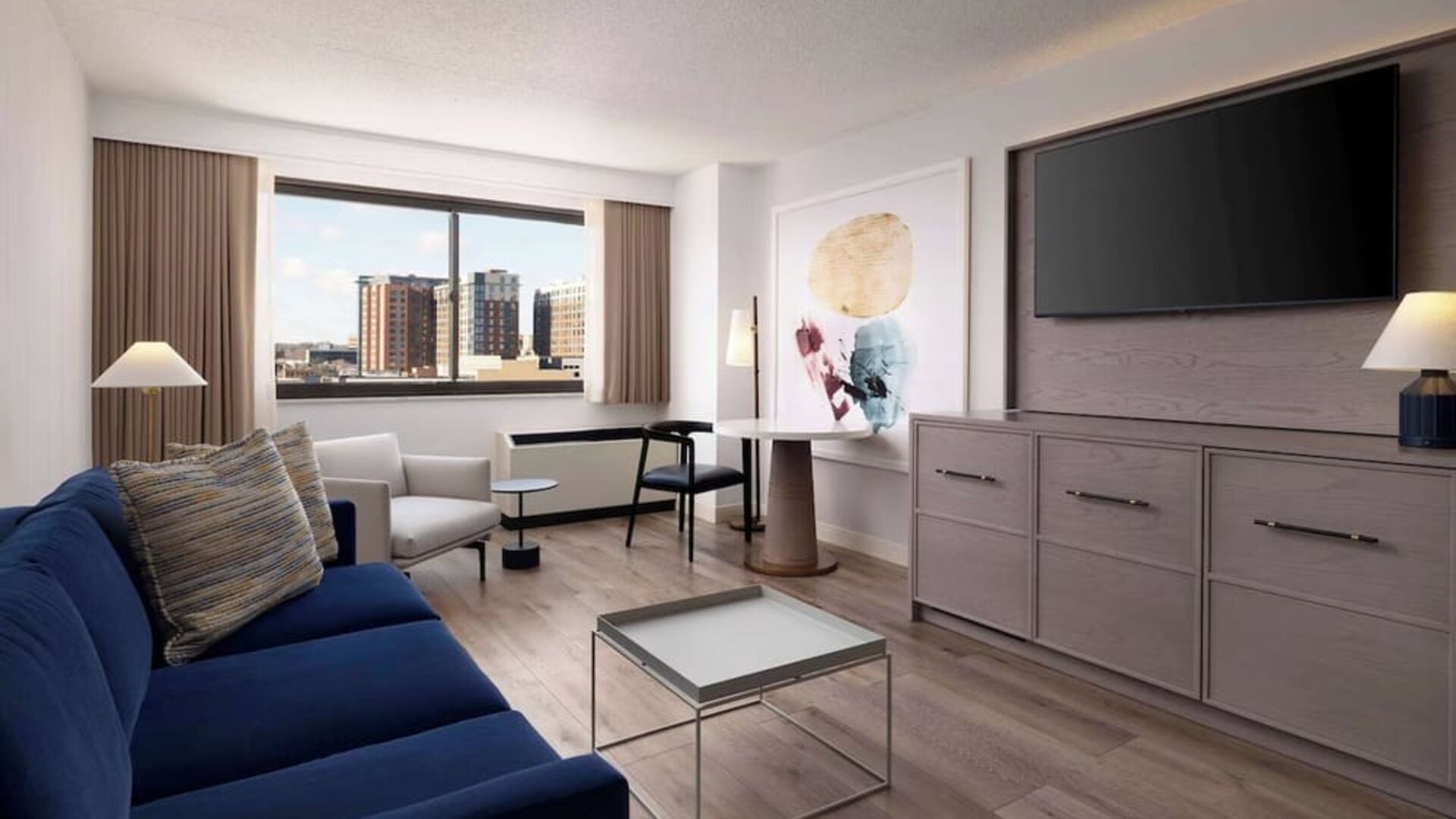 Room workspace with living area at Sonesta White Plains Downtown.