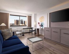 Room workspace with living area at Sonesta White Plains Downtown.