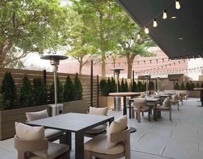 Hotel terrace with seating area, perfect for coworking at Sonesta White Plains Downtown.