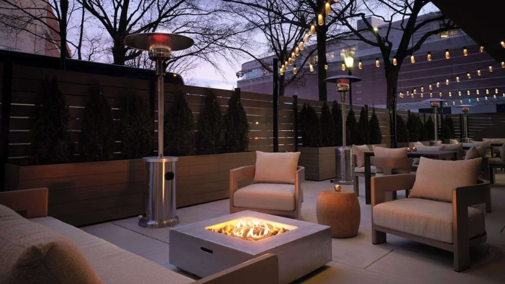 Patio with lounge seating and fire pit at Sonesta White Plains Downtown.