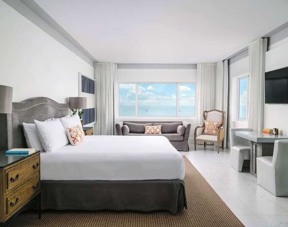 Bright and spacious day use room with workspace and lounge seating at Nautilus Sonesta Miami Beach.