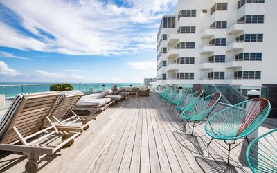 Terrace with lounge seating at Nautilus Sonesta Miami Beach.