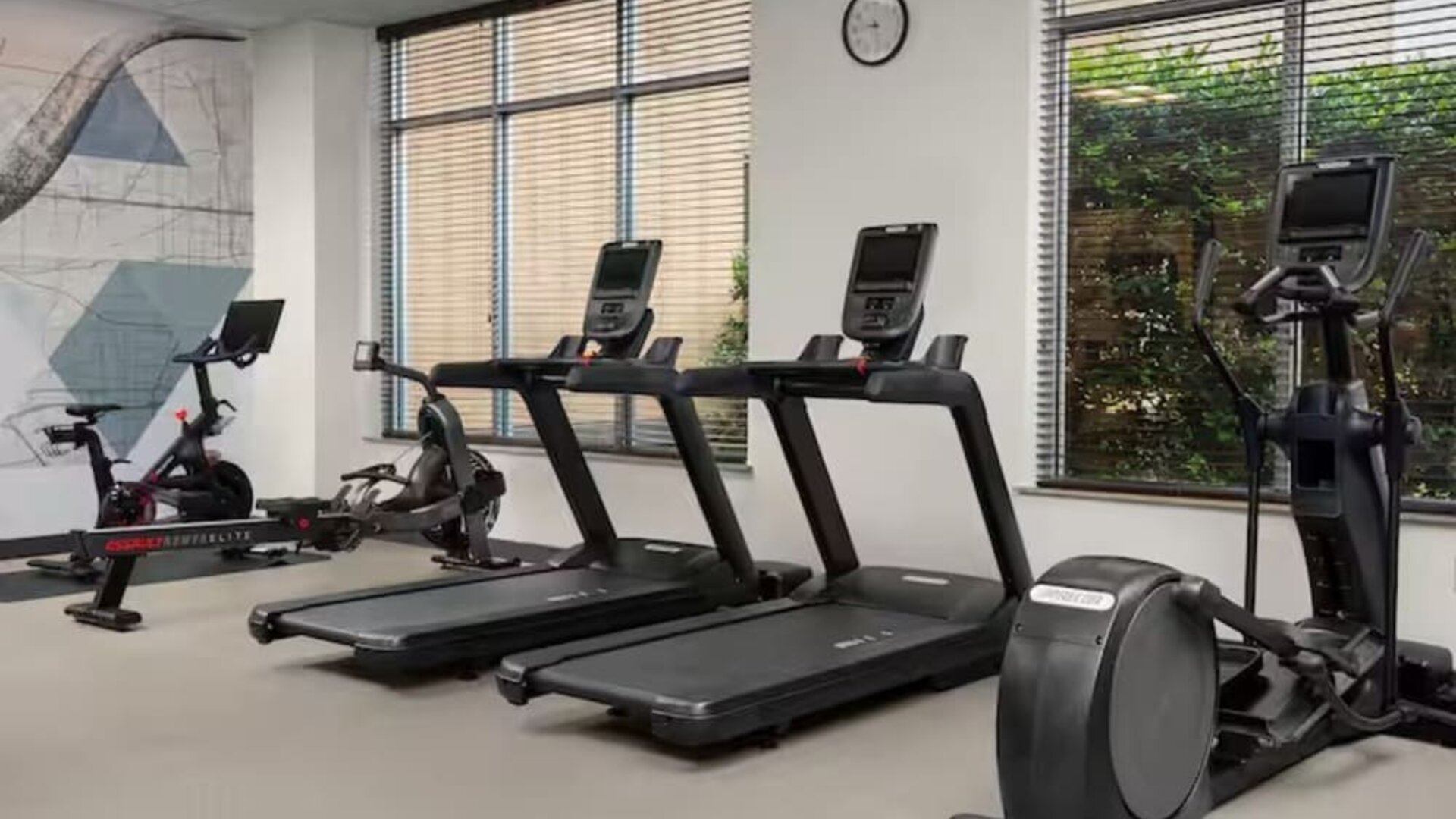 Fitness center with natural light at Hilton Garden Inn Fort Worth Medical Center.