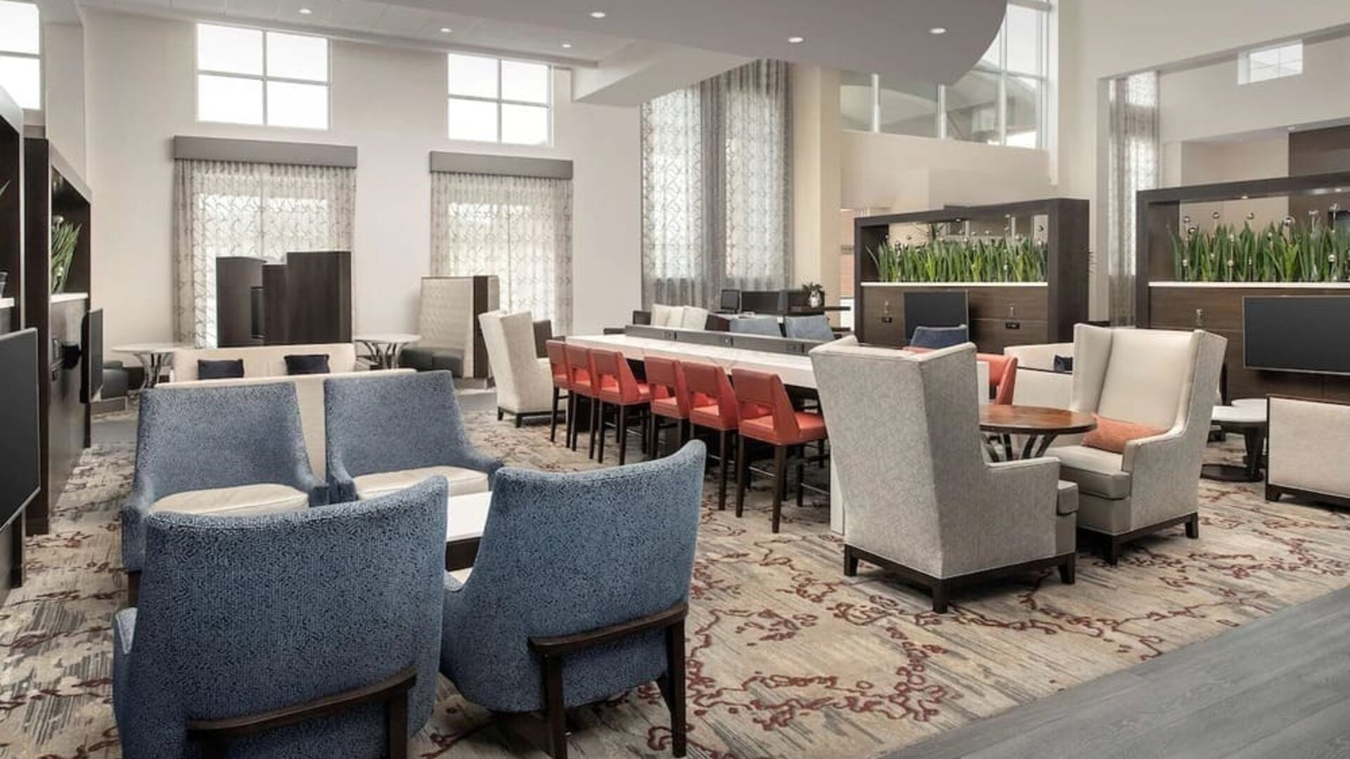 Lobby and coworking lounge at Embassy Suites By Hilton Birmingham.