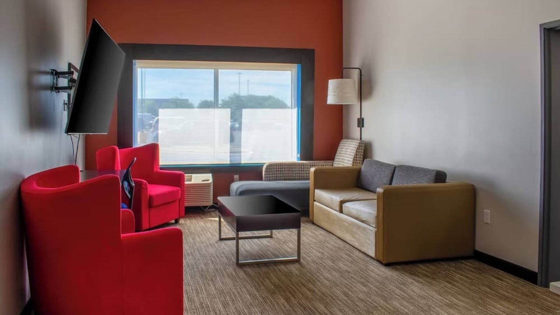 Suite with living room at Holiday Inn Express & Suites Yorkville.