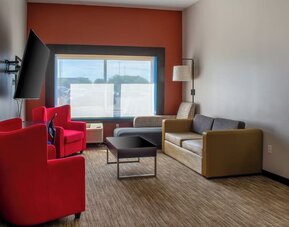 Suite with living room at Holiday Inn Express & Suites Yorkville.