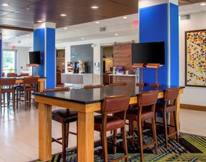 Dining area with comfortable seating perfect for coworking at Holiday Inn Express & Suites Yorkville.