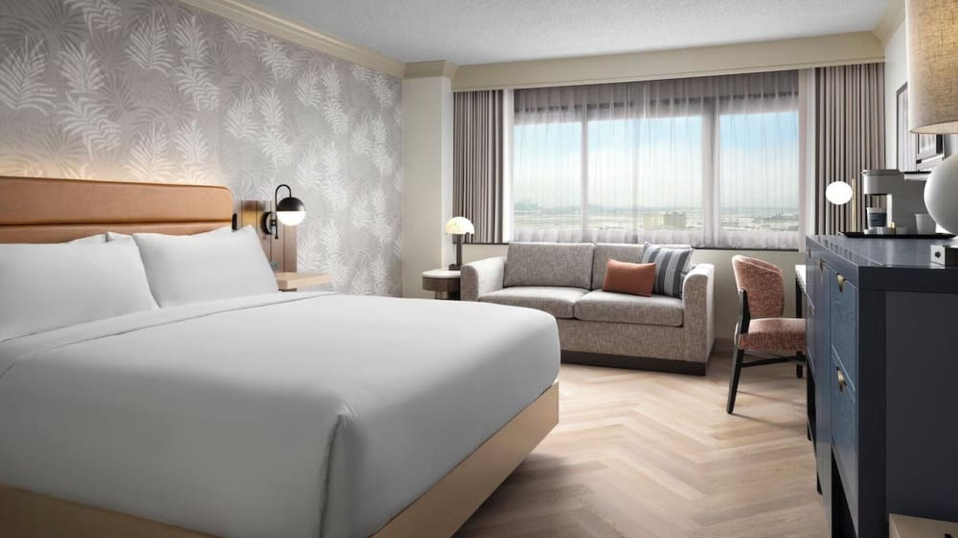 Day use room with work desk and sofa at Sonesta Los Angeles Airport LAX.