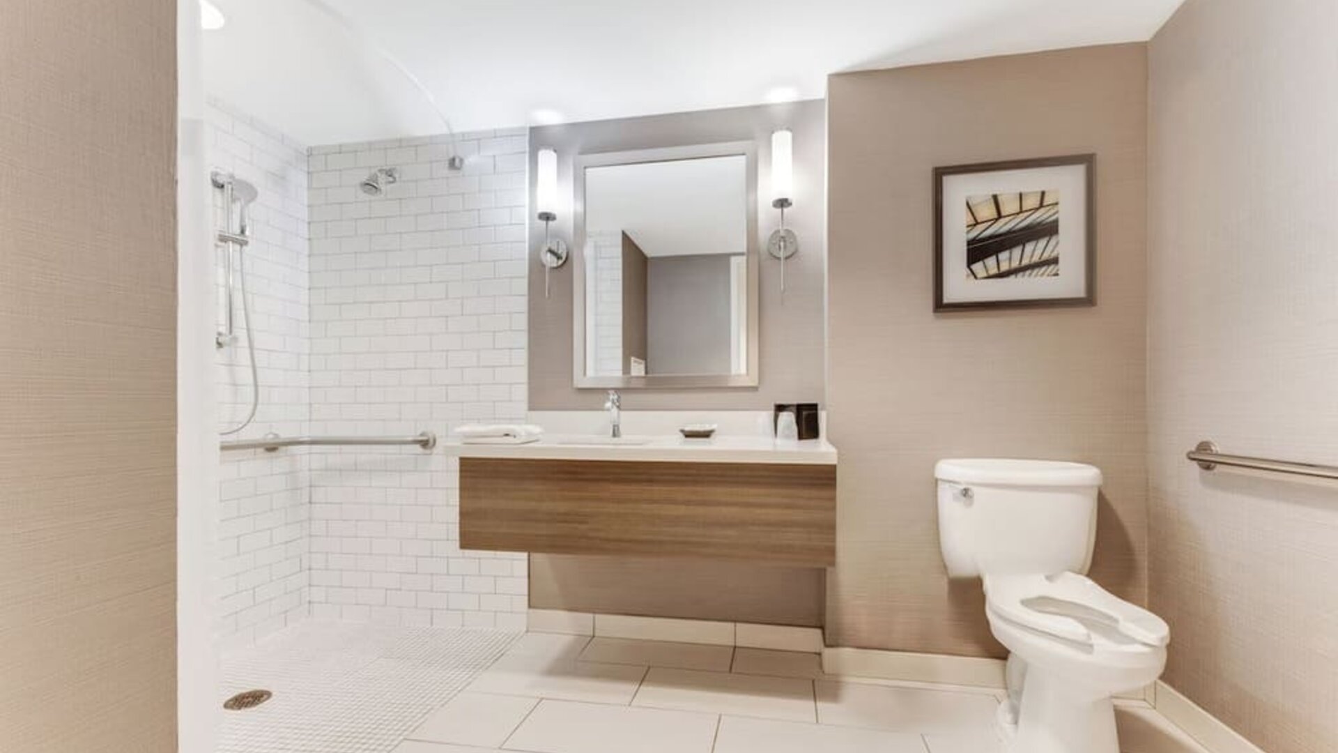 Private guest bathroom with shower and free toiletries at Sonesta Anaheim Resort Area.