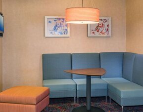 Lobby workspace with comfortable seating at Sonesta ES Suites Charlottesville University.
