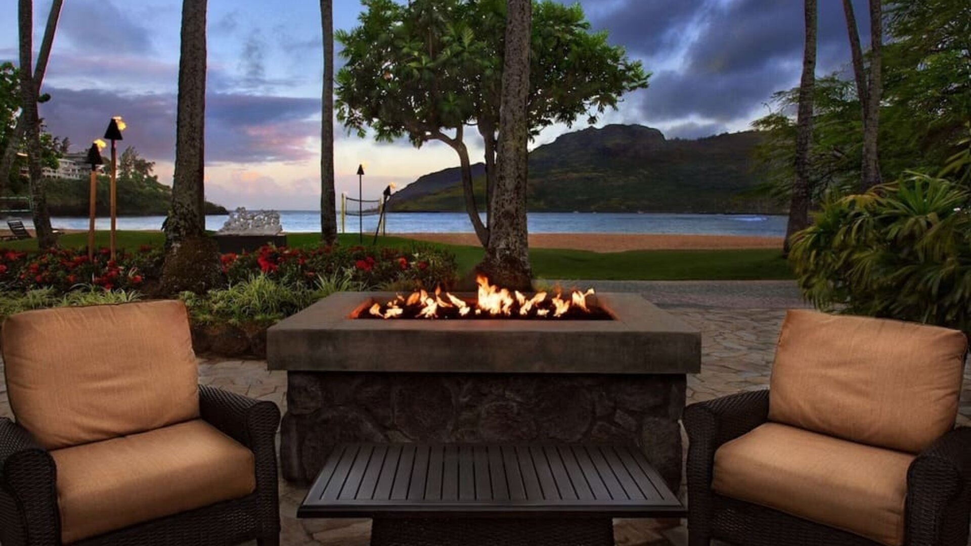 Hotel terrace with lounge seating and fire pit at Royal Sonesta Kaua'i Resort Lihue.